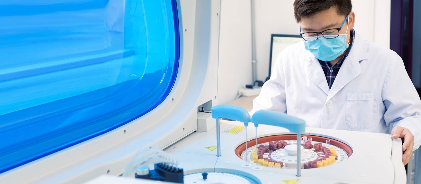 Researcher observing lab equipment