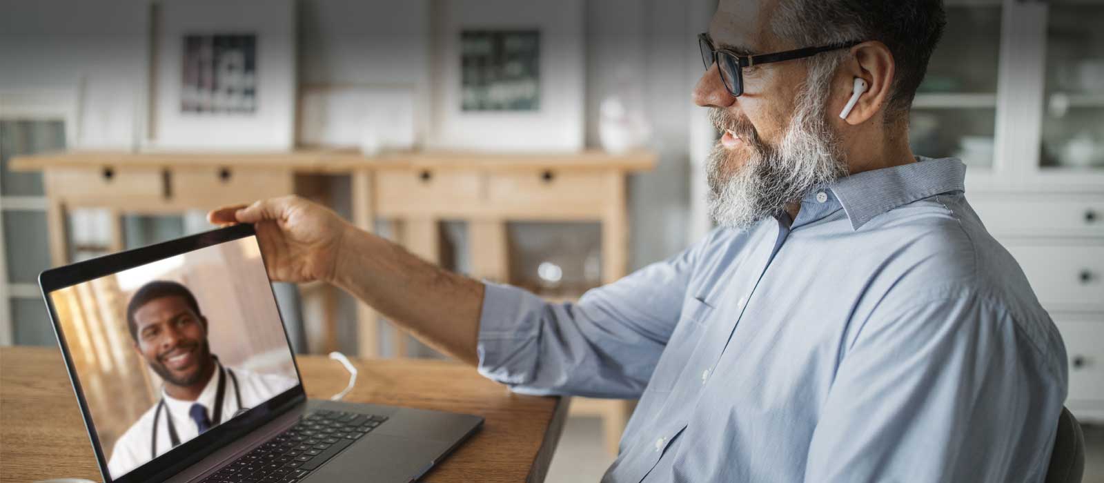 patient speaks with doctor via computer