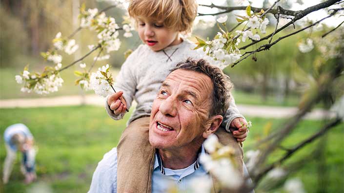 Senior man and boy outdoors