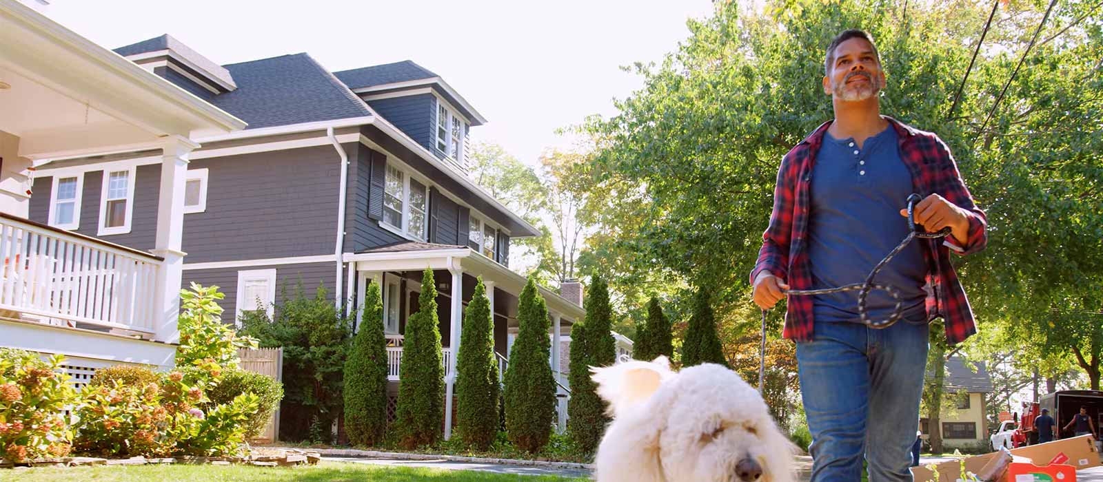 Man walking his dog in neighborhood