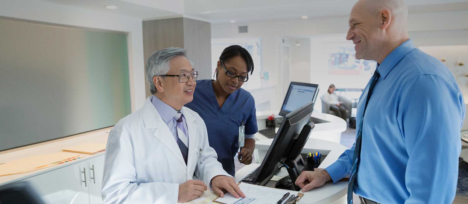 patient checking out with doctor