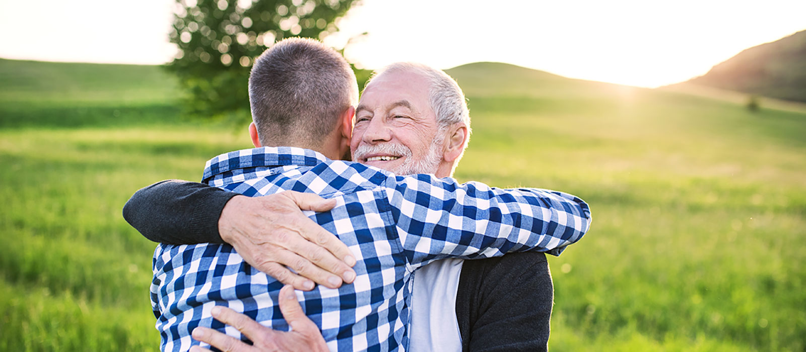 Mature father and son outdoors