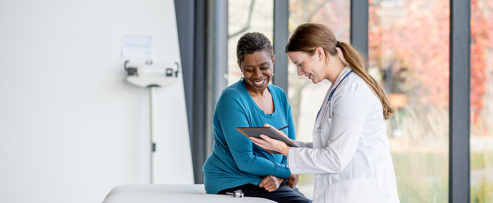 Diverse patient consulting with her doctor