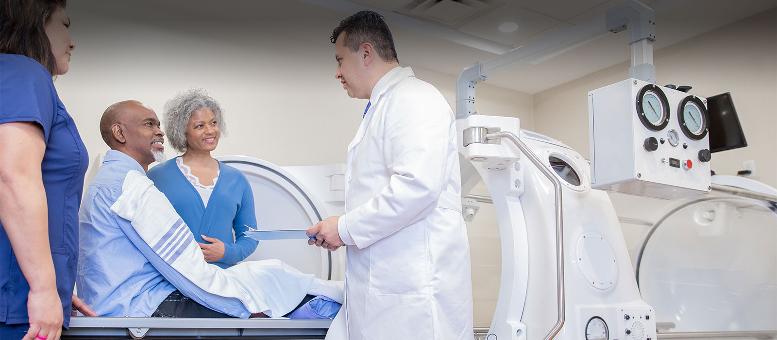 Medical team consulting patient and family 