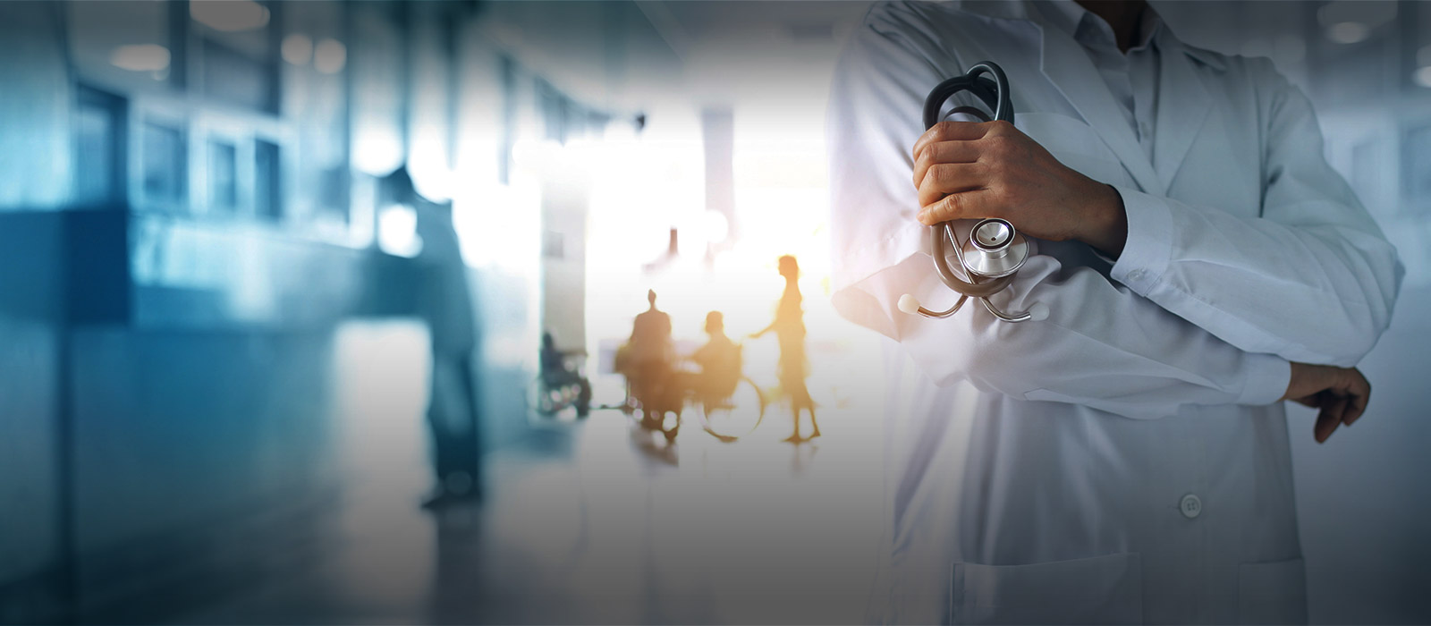 doctor with arms folded in hospital lobby