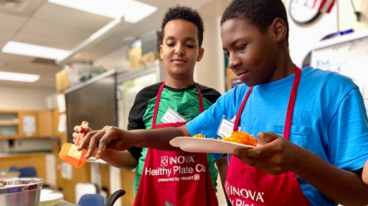 two students cooking